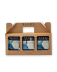 A 3-pack of Reads Coffee Roasters hand-roasted coffee in a brown cardboard carrier tray. The three cans feature blue and white labels with mountain graphics.