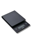 A black digital kitchen scale with an LCD display screen, shown on a plain white background.