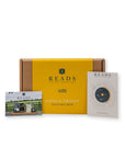 Reads Coffee Roastery Single Origin Tasting Box set, featuring a yellow and brown cardboard box with a yellow label, accompanied by a tasting box photo card and a tasting wheel card on a white background.