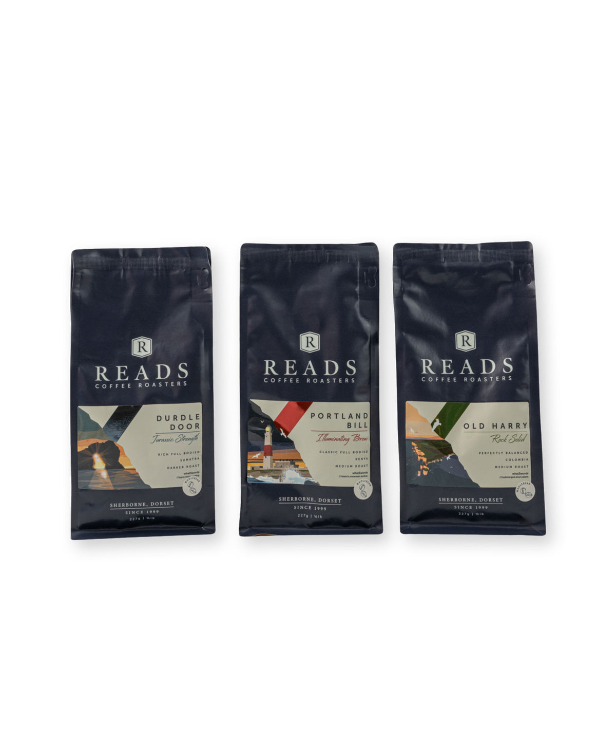 Three bags of Reads Coffee Roastery coffee beans arranged side by side on a white background. The bags are dark navy blue with white text and feature different flavor labels: Sourdish, Portland Bill, and Old Marek.