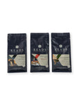Three bags of Reads Coffee Roastery coffee beans arranged side by side on a white background. The bags are dark navy blue with white text and feature different flavor labels: Sourdish, Portland Bill, and Old Marek.
