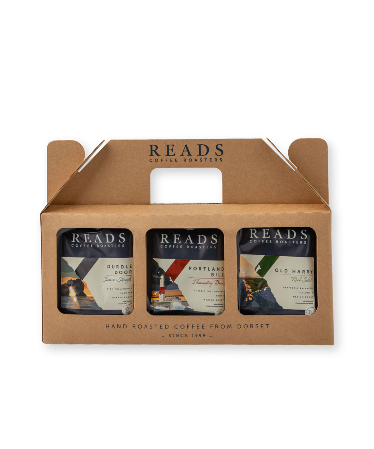A three-pack of Reads Coffee Roasters in a brown cardboard carrier with a handle, shown on a plain white background.