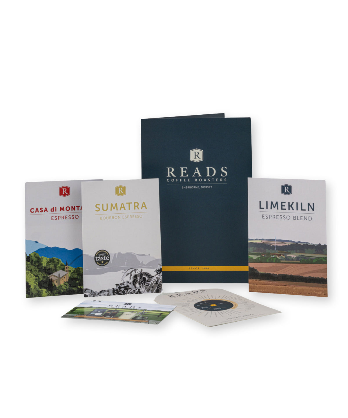 A coffee gift set from Reads Coffee Roasters on a white background, including three printed coffee bag cards (Casa di Montasio Espresso, Sumatra, and Limekiln Espresso Blend), a dark navy tote bag, a booklet, and a small printed card.