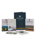 A coffee gift set from Reads Coffee Roasters on a white background, including three printed coffee bag cards (Casa di Montasio Espresso, Sumatra, and Limekiln Espresso Blend), a dark navy tote bag, a booklet, and a small printed card.