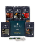 Reads Coffee Roastery Espresso Box gift set featuring five dark navy coffee bean bags arranged around a teal gift box, with a small card and tag in front, on a white background.