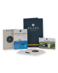 A coffee roasting education kit by Reads Coffee Roasters on a white background, including a navy guidebook, a tasting notes booklet, a flavor profile card, a small photo card, and several vinyl record sleeves.