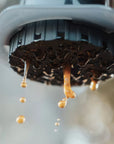 Close-up of coffee dripping from a coffee machine