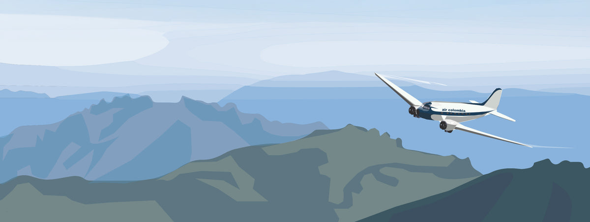 Airplane flying over a mountainous landscape with a clear blue sky.