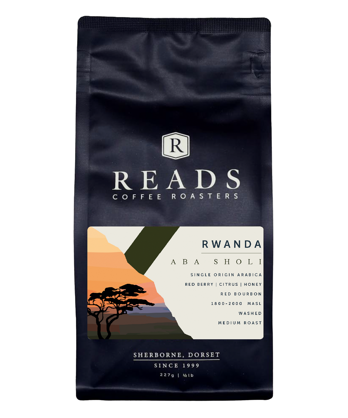 A 227g bag of Reads Coffee Roasters Rwanda Aba Sholi single origin arabica coffee, featuring a dark navy blue bag with a scenic landscape label on the front.