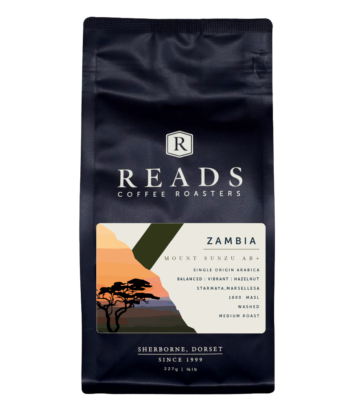 A bag of Reads Coffee Roasters 'Zambia' coffee in a matte black pouch with a colorful landscape label and white text.